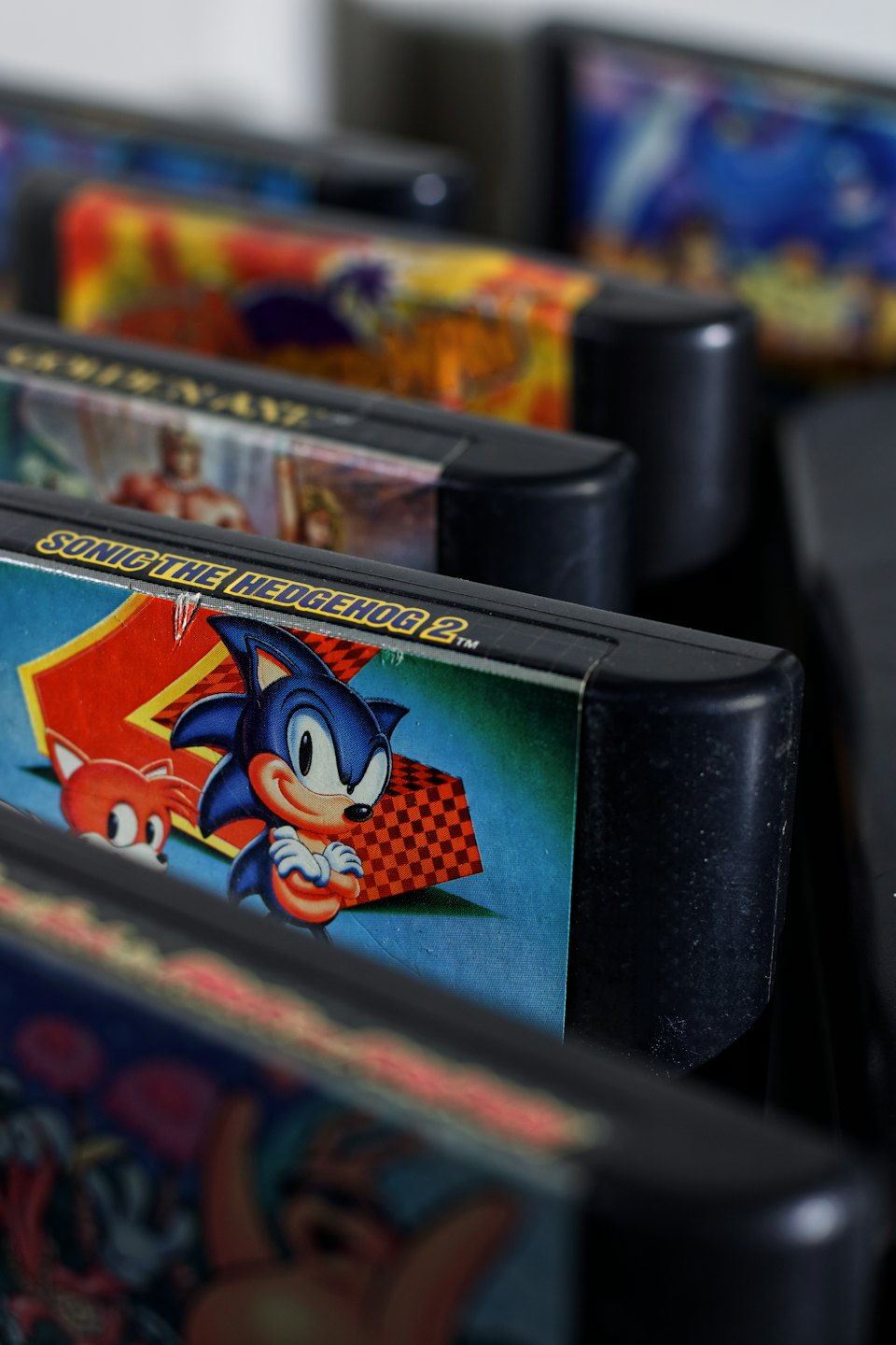 Retro Sega Genesis game cartridges lined up.
