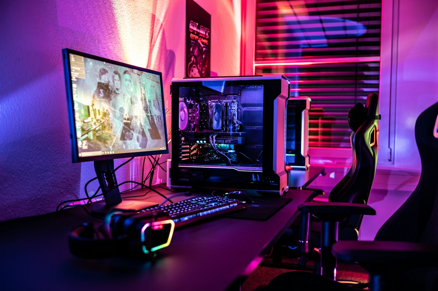 Gaming computer setup with illuminated PC and monitor.